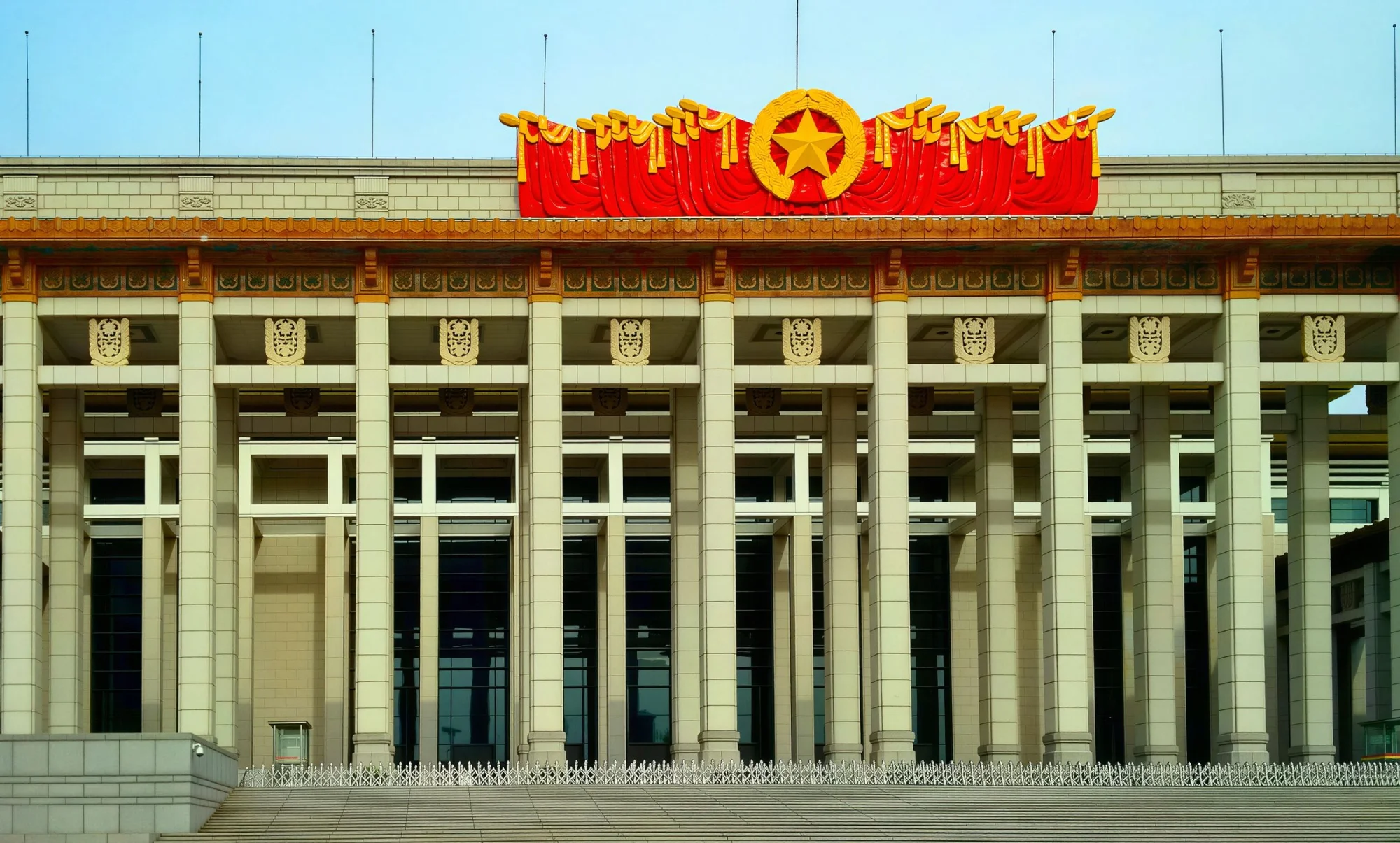 A grand civic center in Beijing with pillars and Chinese cultural motifs.