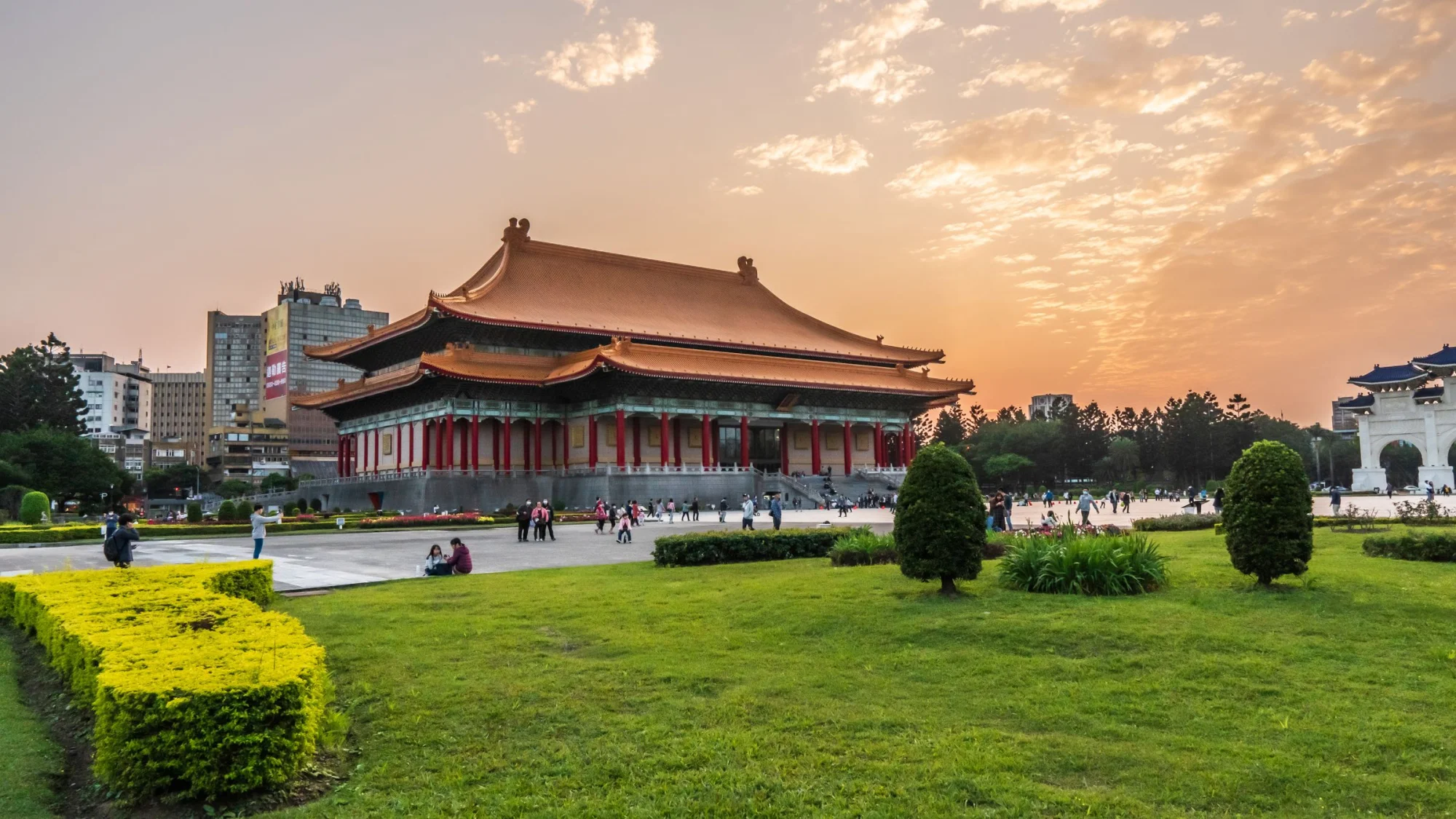 Scenic view of the National Theater in Taipei, Taiwan during sunset with a lush garden foreground.