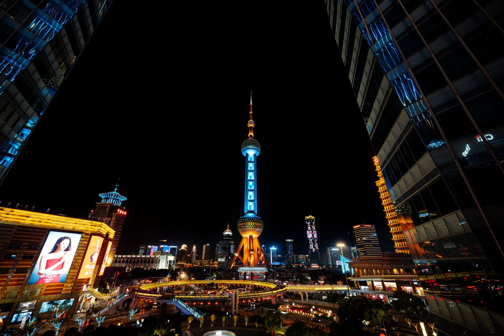 Captivating cityscape of Shanghai's illuminated skyline with the iconic Oriental Pearl Tower.