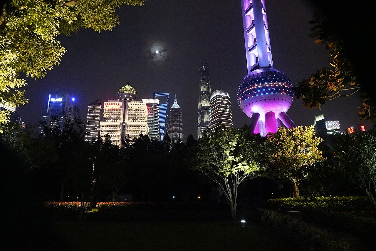 The picture shows: Oriental Pearl, Shanghai Tower, Jinmao Tower, world financial center, Ping An building. and the moon and clouds.