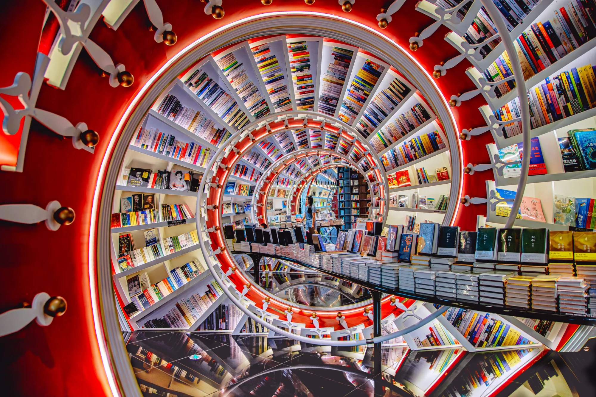 Explore a striking spiral design bookstore filled with rows of vibrant books in Shenzhen, China.