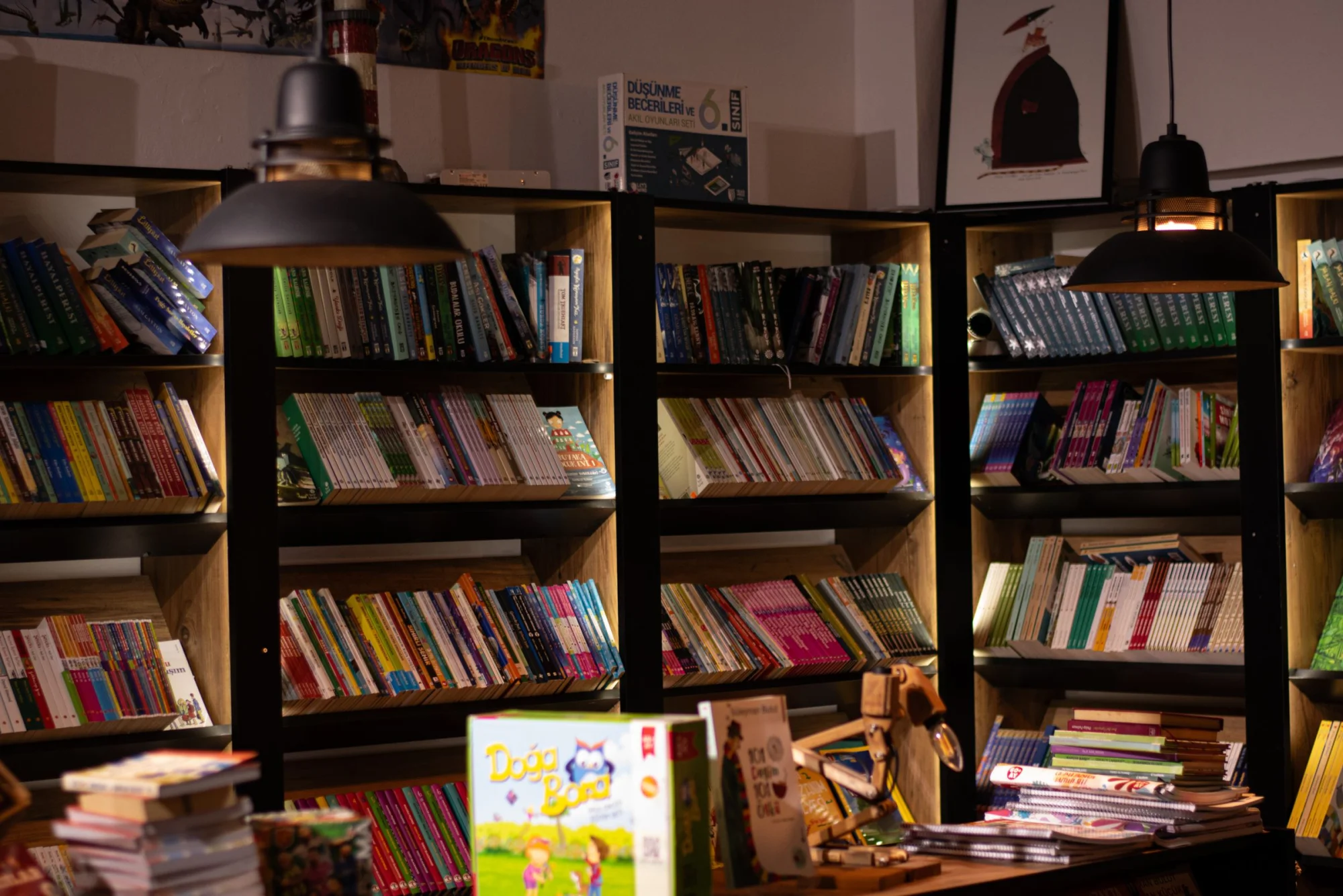 Warmly lit bookshelves create a cozy ambience in this inviting bookstore interior.