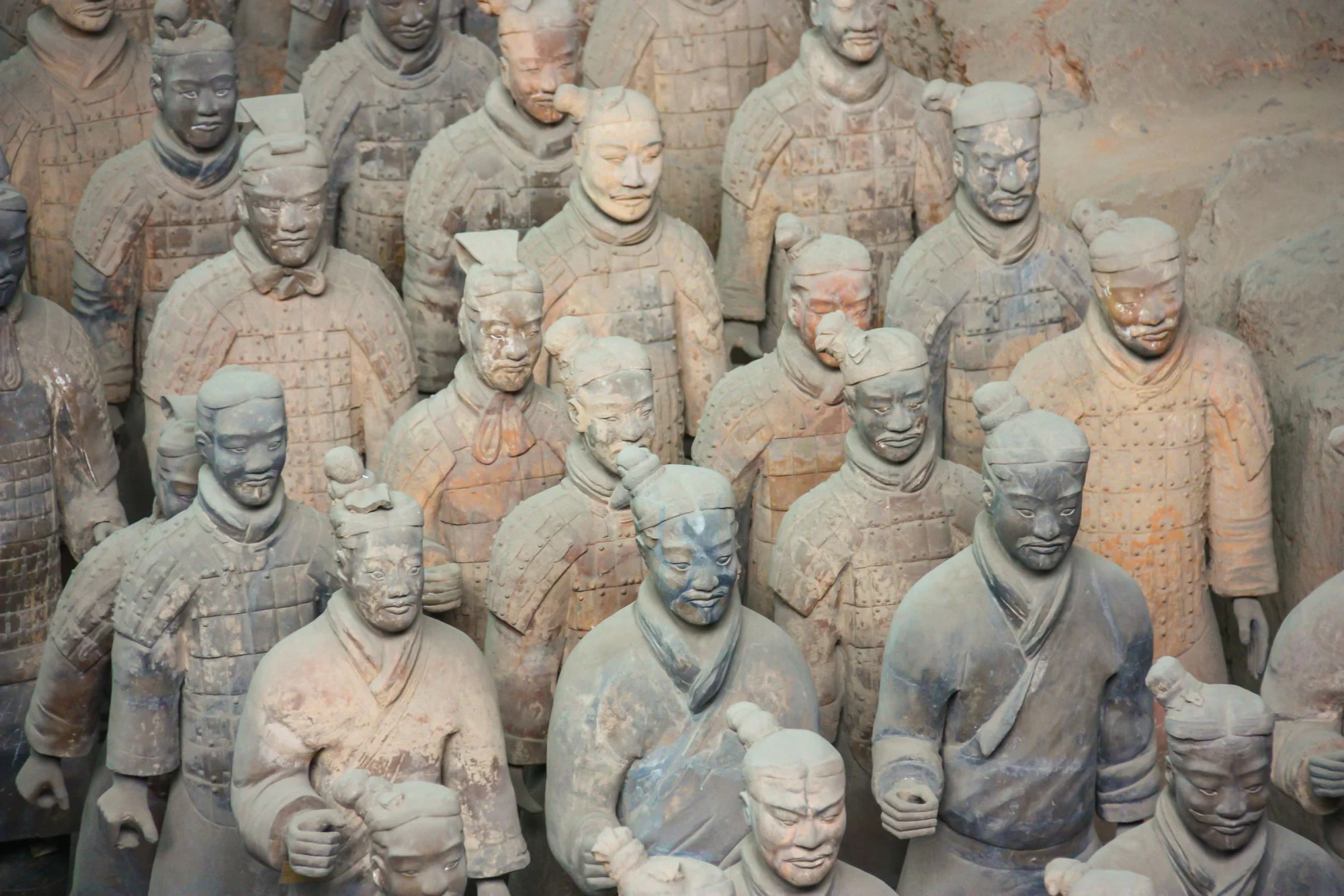 Close-up view of the ancient Terracotta Army statues in Xi'an, showcasing historical artistry.