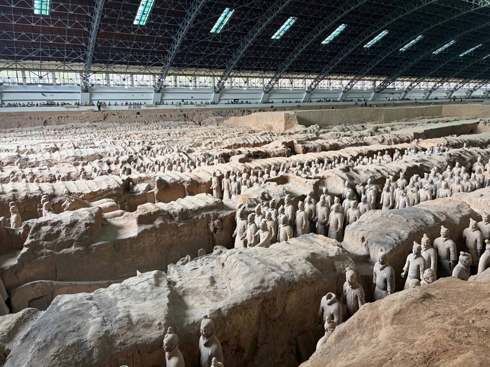 The ancient Terracotta Army figures in Xi'an, China at the archeological excavation site.