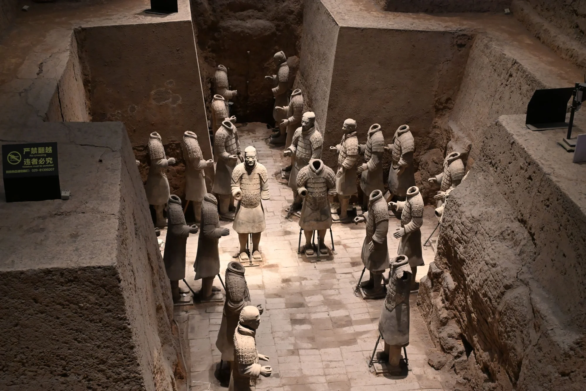 Close-up view of the famous Terracotta Army statues unearthed in a pit, showcasing ancient Chinese history.